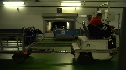 Truck with baggage driving through cargo department at the airport. Stock Footage 117173906