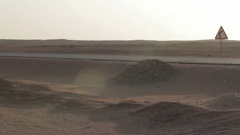 A truck barrels down an empty desert road Egypt Stock Footage 90929508