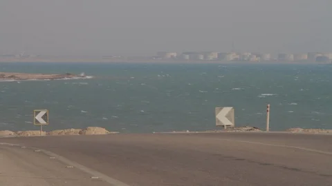 A truck barrels down an empty road by a river Egypt Stock-Footage 90929713