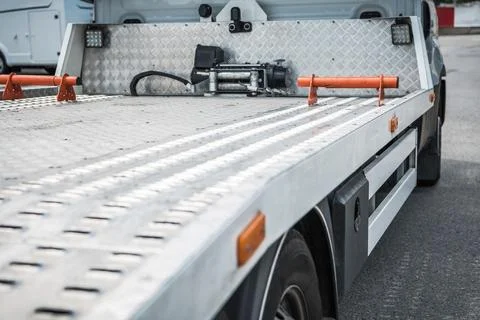 Truck Bed Ready for Loading Vehicles in a Busy Area Fotos Stock