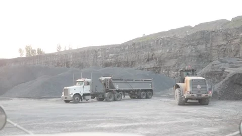 Truck being filled by a loader in a quarry Video stock 255852580