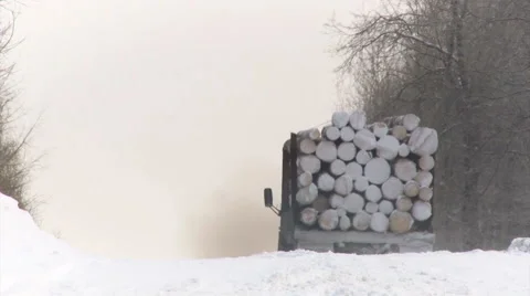 Truck Brining Logs Down the Hill. Winter Stock Footage 65492089