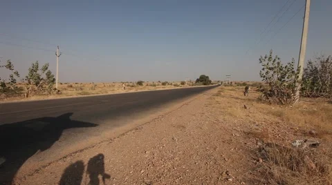 Truck crossing Empty road  in middle of biggest desert in north africa Sahara Stock Footage 45380847