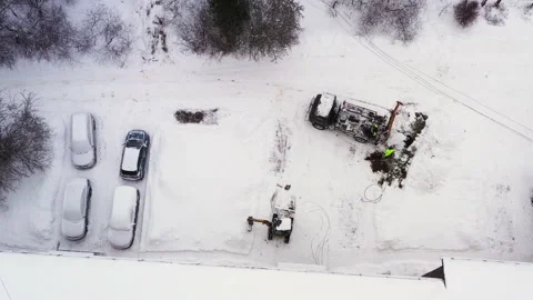 Truck digging hole for utility pole in  winter, aerial view Stock Footage 227505087