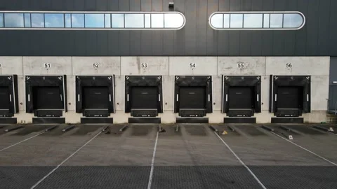 Truck dock platform logistics warehouse empty space door for loading and Stock Footage 144790427