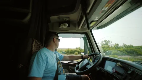 Truck Driver Delivering Freight. inside the cabin rotate camera Video stock 93639645