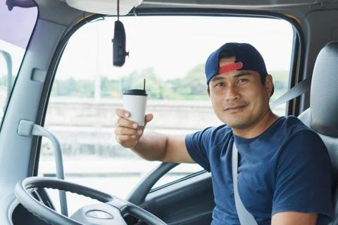 The truck driver is drinking coffee Foto stock