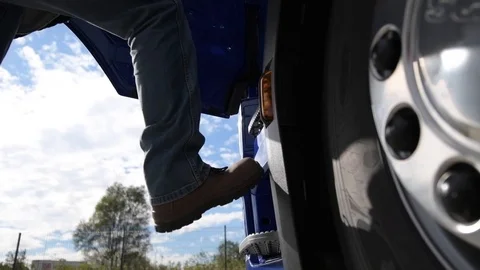 Truck Driver Getting into the Semi Cabin. European Transportation. Stock Footage