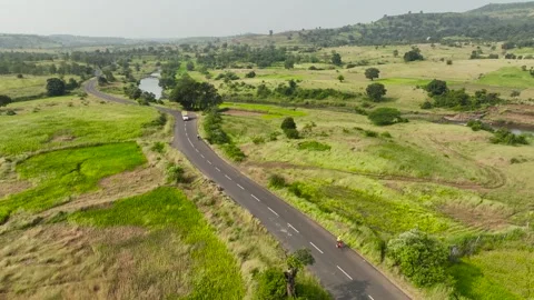 Truck driver overtakes two cyclists. people ride bicycle on road in nature .. Stock Footage 283991004