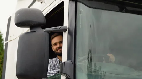 Truck driver sitting in cab Stock Footage 251839951