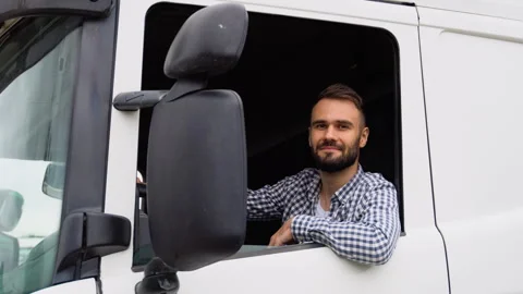 Truck driver sitting in cab Stock Footage 251840485