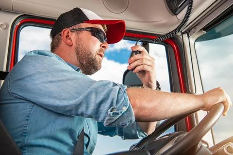 Truck Driver Taking Conversation Using CB Radio Stock Photos