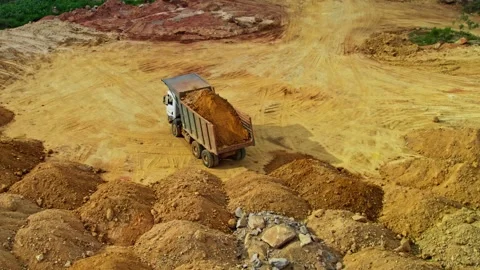 Truck driver trying to unload soil in construction area at telangana, india Stock Footage 301067846