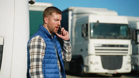 Truck driver using smartphone outdoors Stock-Footage 299744653