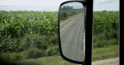 Truck driver View for window and mirror. Man driving car at country road on warm Video stock 136200849