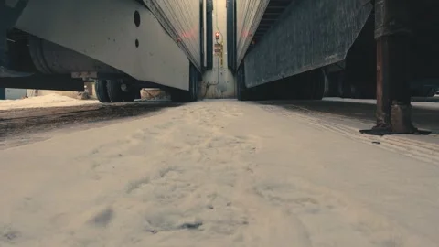 Truck driver walking between trailers in winter snow Stock-Footage 346972038