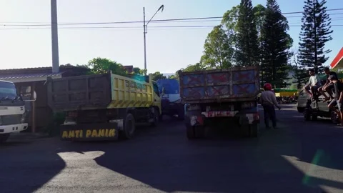 Truck Drivers Waiting in a Long Queue Amidst a Fuel Crisis in Indonesia Stock Footage 318997193