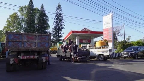 Truck Drivers Waiting in a Long Queue Amidst a Fuel Crisis in Indonesia Stock Footage 318997279