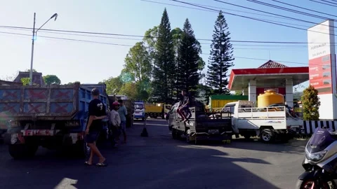 Truck Drivers Waiting in a Long Queue Amidst a Fuel Crisis in Indonesia Stock Footage 318998445