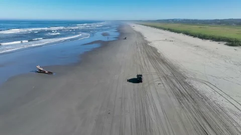 Truck driving down the beach Stock Footage 220681916