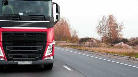 Truck is driving on the interstate highway. Close-up of the front of the truck 스톡 동영상 166169952