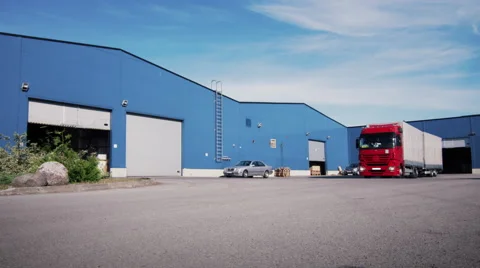 Truck is Driving from Logistics Warehouse. Aerial Shot. Stock Footage