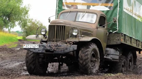 Truck driving over mud Stock Footage 157323309