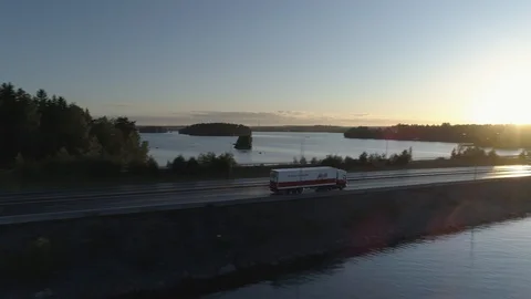 Truck Driving Over Strait During Sunset Video stock 85977856
