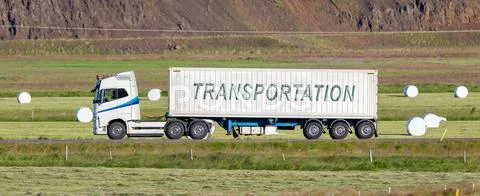 Truck driving through a rural area - Transportation Stock Photos