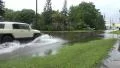 Truck Driving Thru Flood Street 4k or 4k+ Resolution