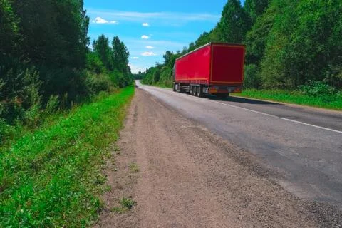 Truck on empty highway Stock Photos