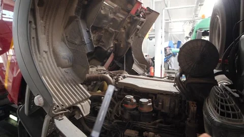 Truck engine maintenance in progress at repair shop in service center. Video stock 313815211