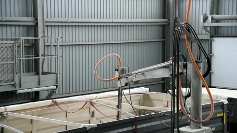 The truck is inside a large warehouse or hangar. A truck with a trailer tha.. Vídeo Stock 339766101