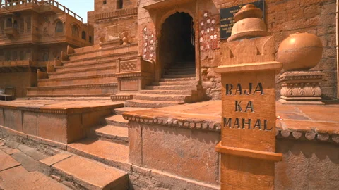 Truck left view of Raja Ka Mahal pillar and palace stairs in Jaisalmer Fort Stock Footage 346115400