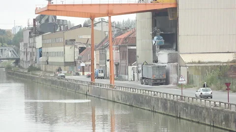 Truck loading raw materials into a river port Stock Footage 46259963