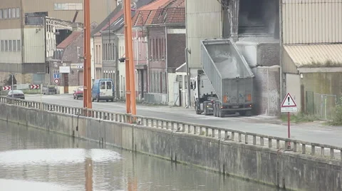 Truck loading raw materials into a river port Stock Footage 46261516