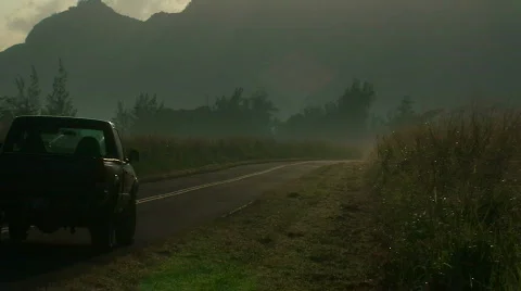 Truck on misty morning road Stock Footage