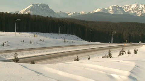 Truck on mountain highway in winter 1 Stock Footage