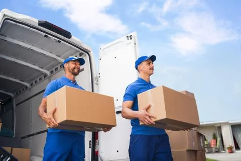 Truck Movers Loading Van Carrying Boxes Stock Photos