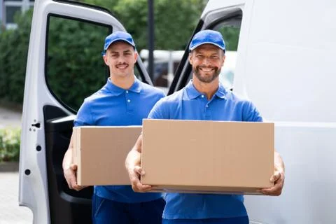 Truck Movers Loading Van Carrying Boxes Stock Photos