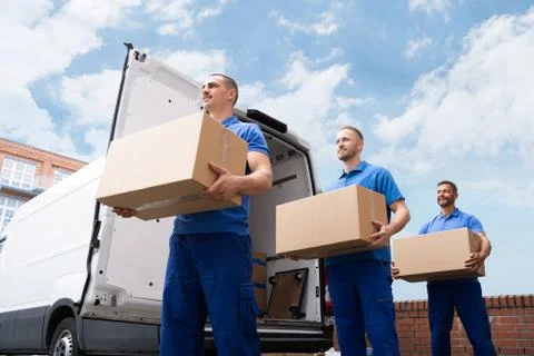Truck Movers Loading Van Carrying Boxes Foto stock