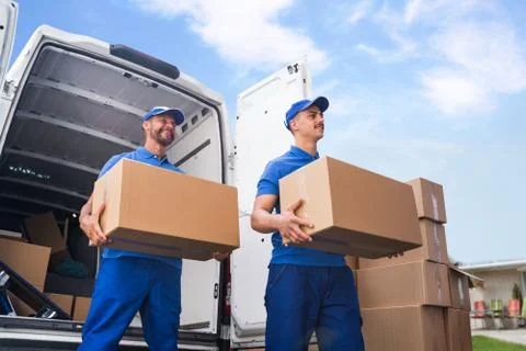 Truck Movers Loading Van Carrying Boxes Stock Photos