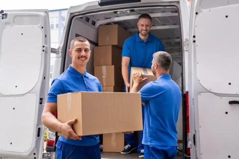 Truck Movers Loading Van Carrying Boxes Stock Photos