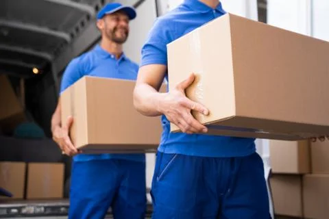 Truck Movers Loading Van Carrying Boxes Stock Photos