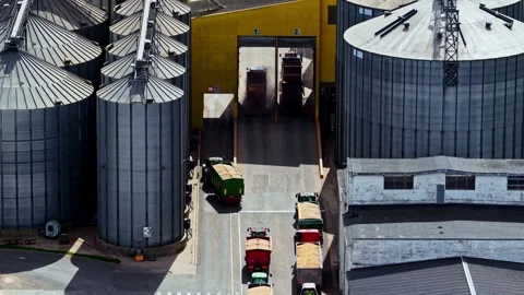 Truck moving inside a feed grain warehouse. Aerial view Stock Footage 318965189