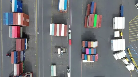 Truck moving through shipping container yard Video stock 332746020