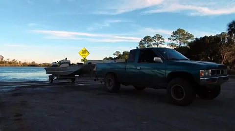 Truck pulling boat from water Stock-Footage 45299964