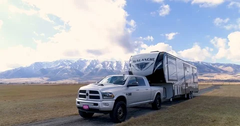 Truck Pulling Camper Trailer on Dirt Road 4K Stock Footage