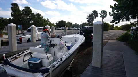 Truck Pulling Out A Boat From Docks on Trailer Stock-Footage 158345915