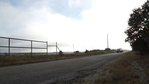 Truck Pulling into a Ranch Gate, Geared Up for a Hunt Video stock 82123821